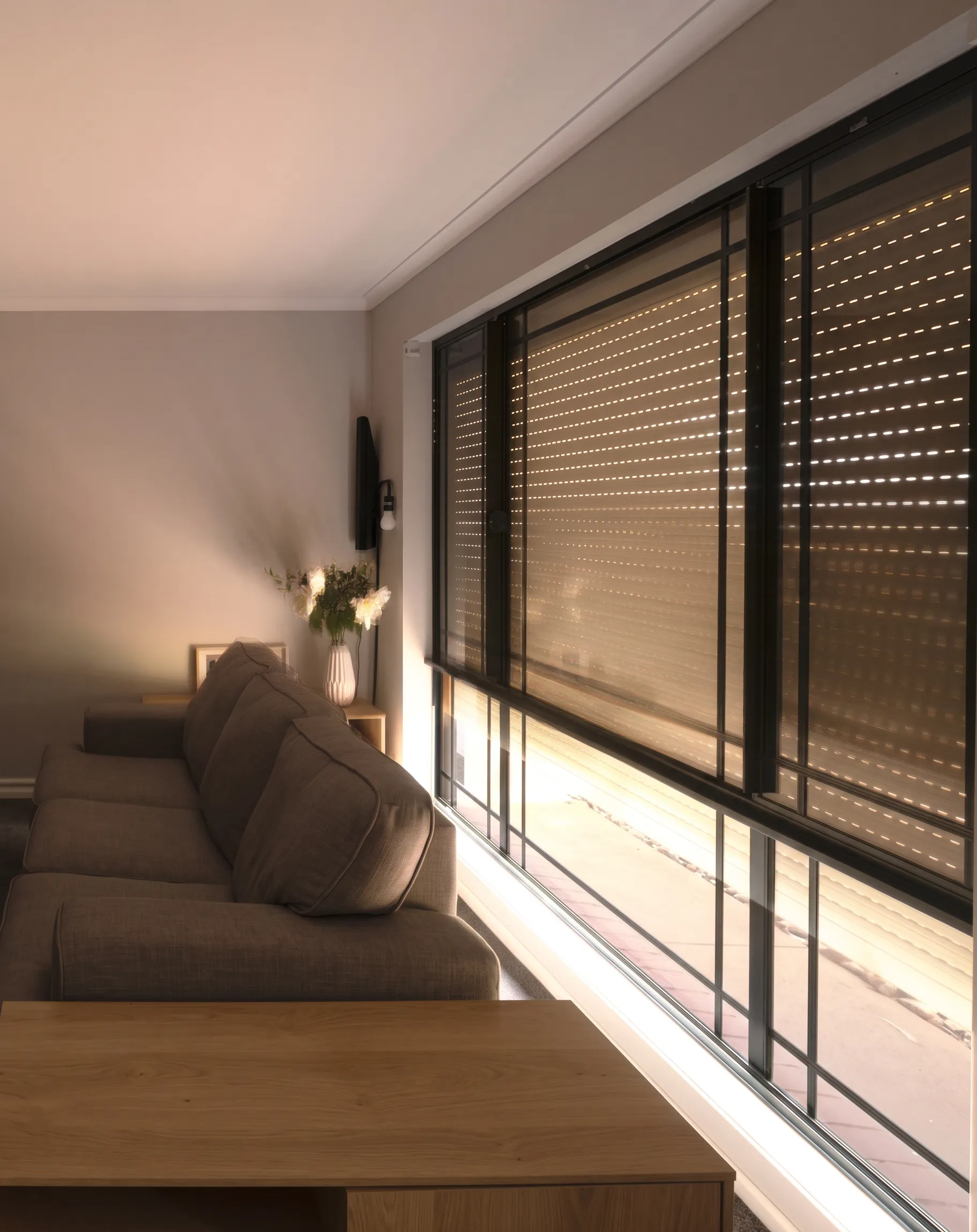 Roller shutters securing a residential window at night