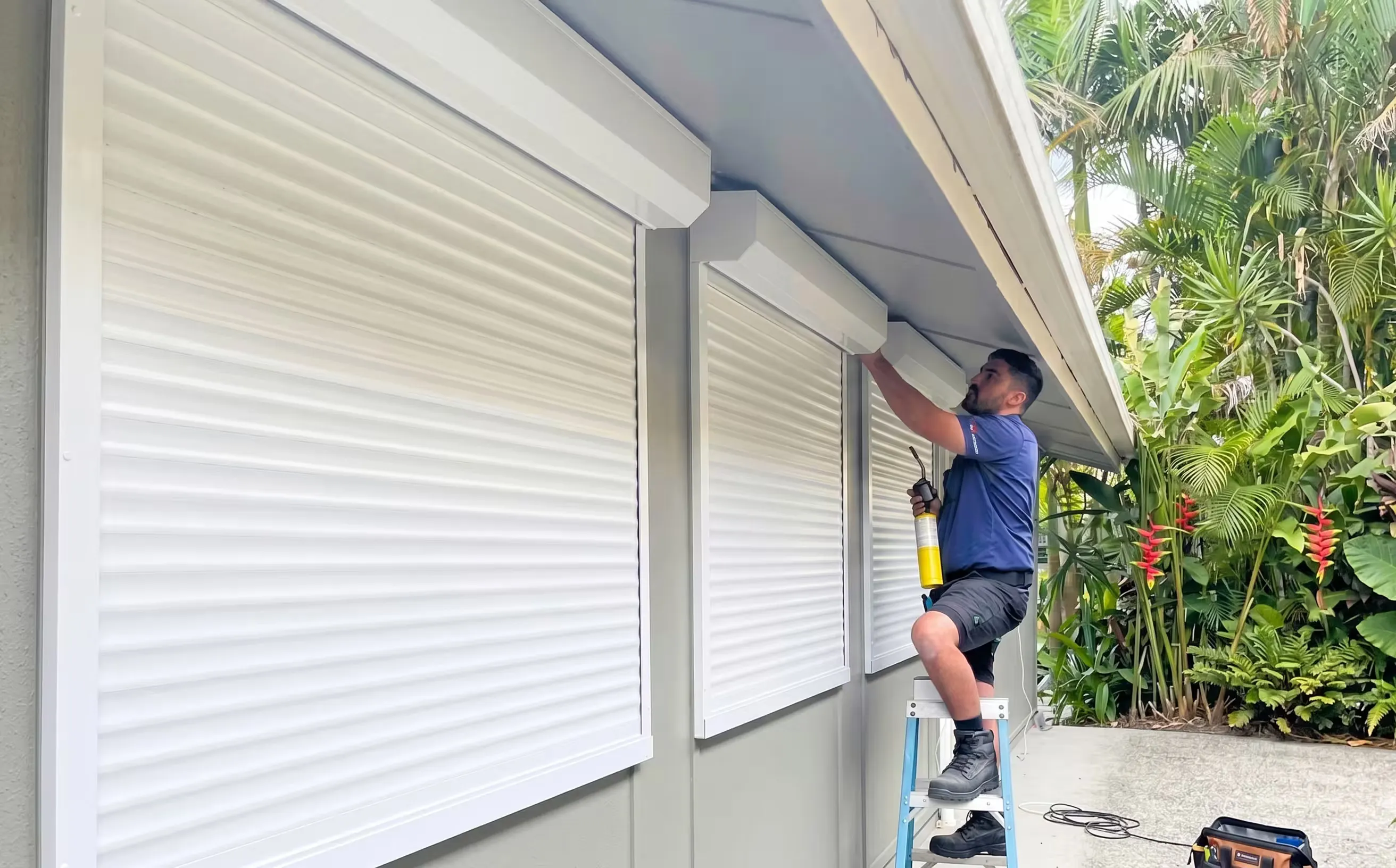 Professional installer fitting a roller shutter